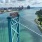 a bridge with Detroit in the background
