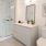 Well-lit bathroom with glass shower