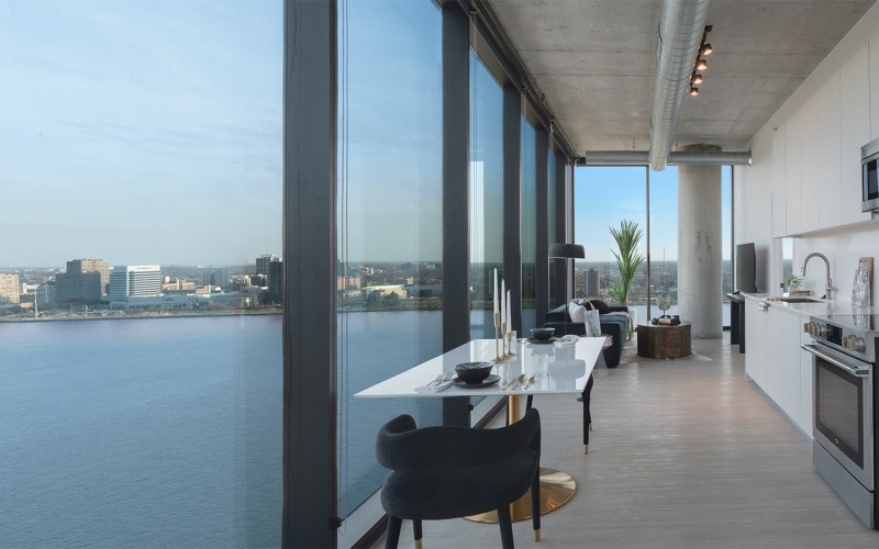 a living room with a view of the water